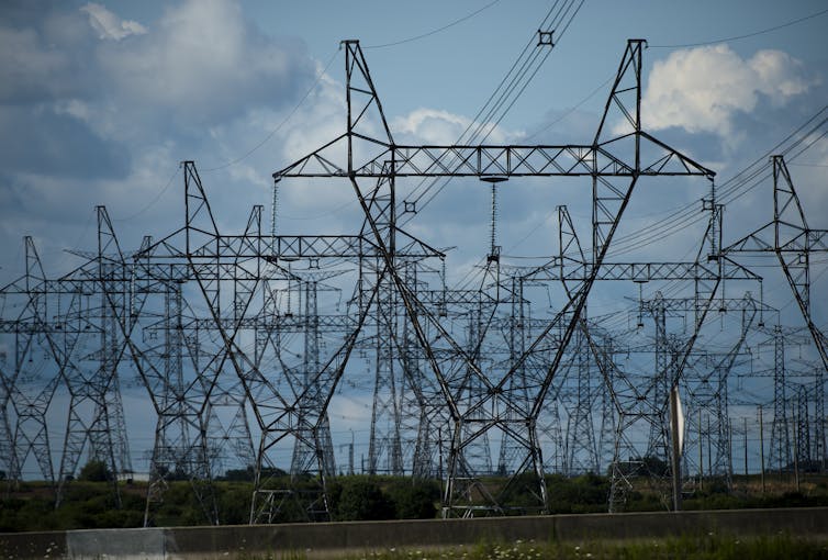 hydro towers against a blue sky