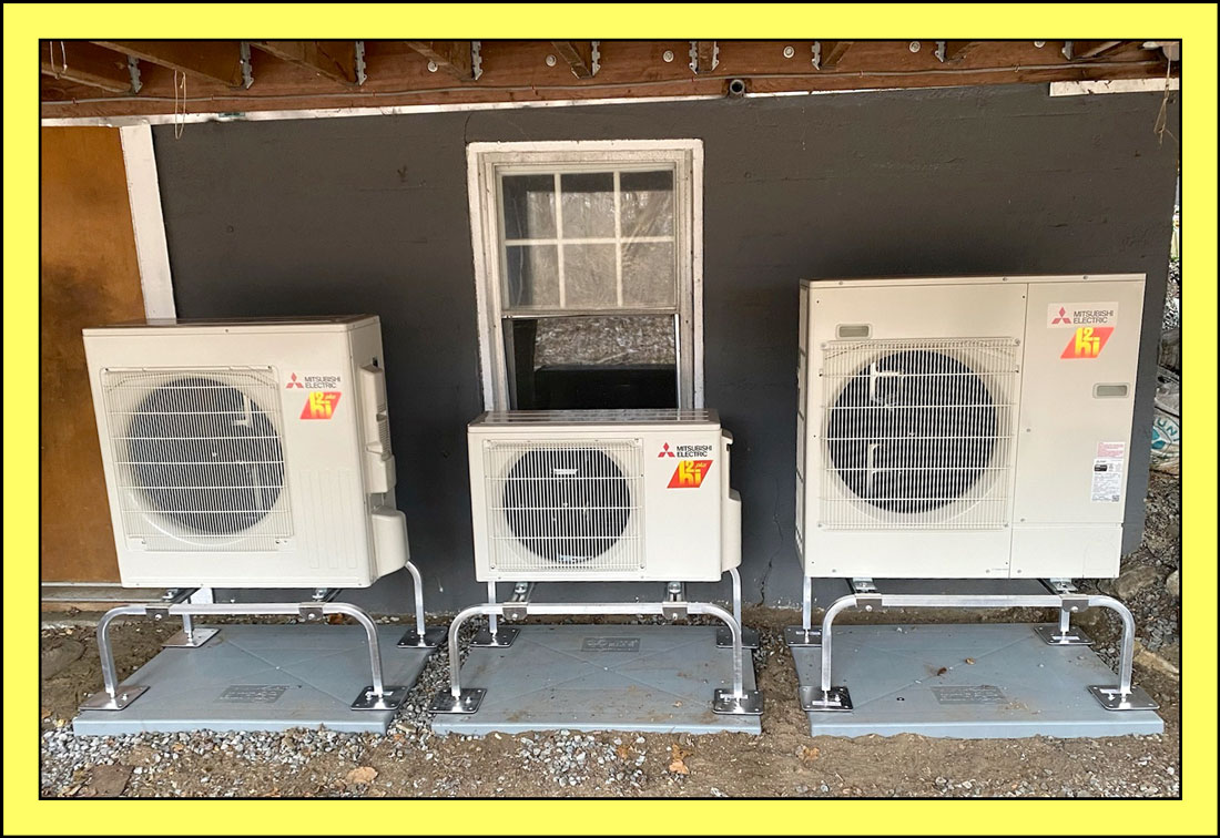 Three heat pumps outside Tik's home